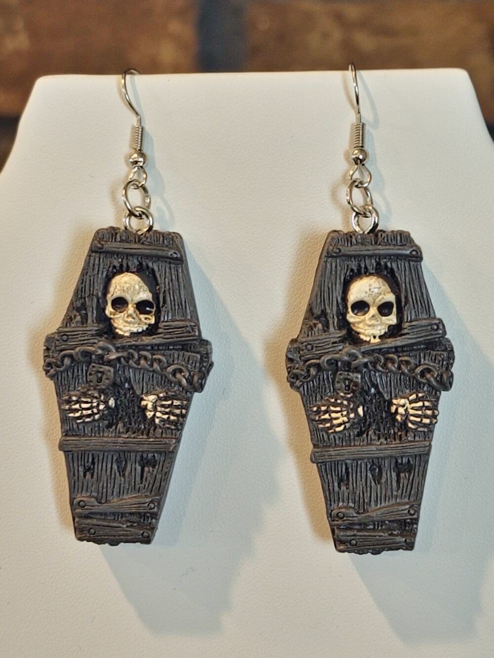 Coffin Shaped Earrings With White Skull and Skeletal Hands Reaching Out